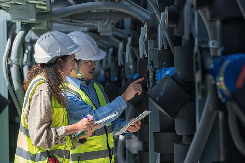 worker checking job in plant room