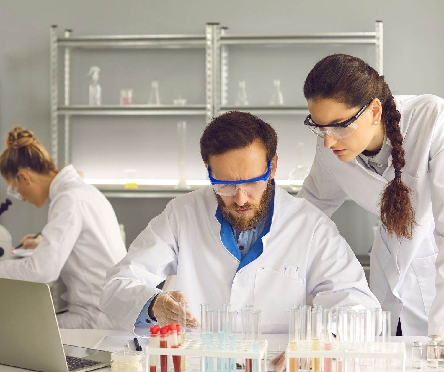 Pharmacists carrying out tests with test tubes