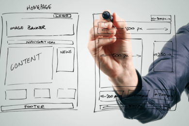 A person in a dark blue shirt is drawing a wireframe website design on a transparent surface with a black marker. The wireframe sketch outlines a homepage layout, including sections for a logo, image banner, navigation bar, content, news, and footer.