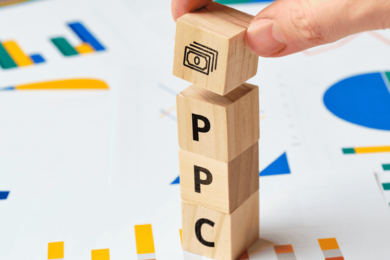 wooden blocks with PPC written on them with graphs in the background